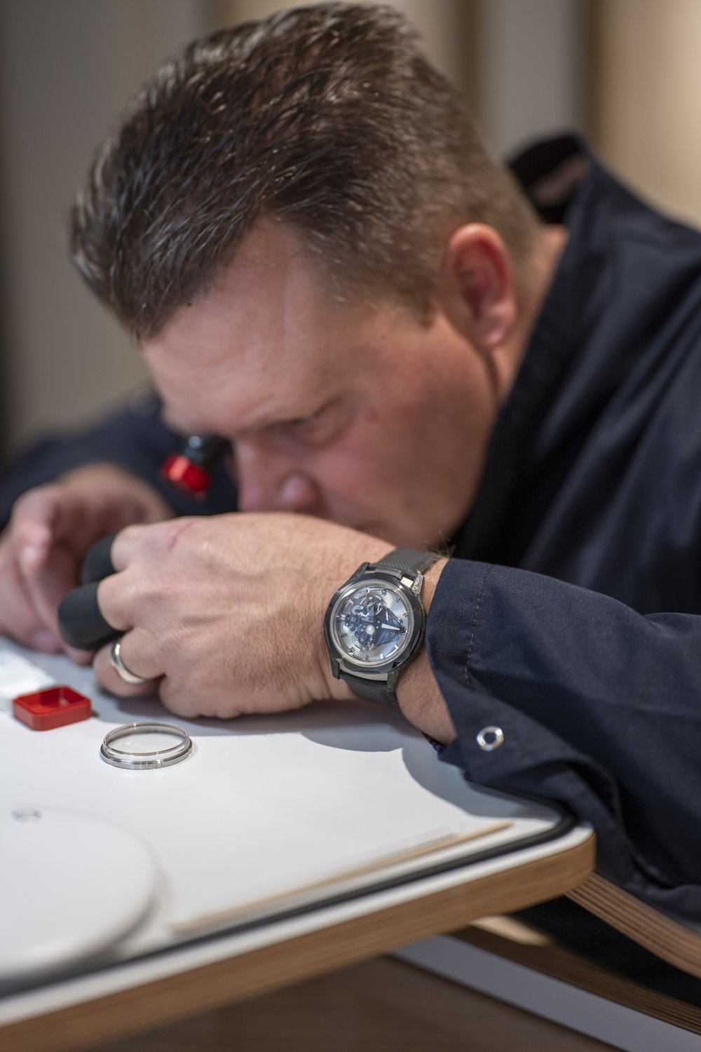 The watchmaker at work on the movement